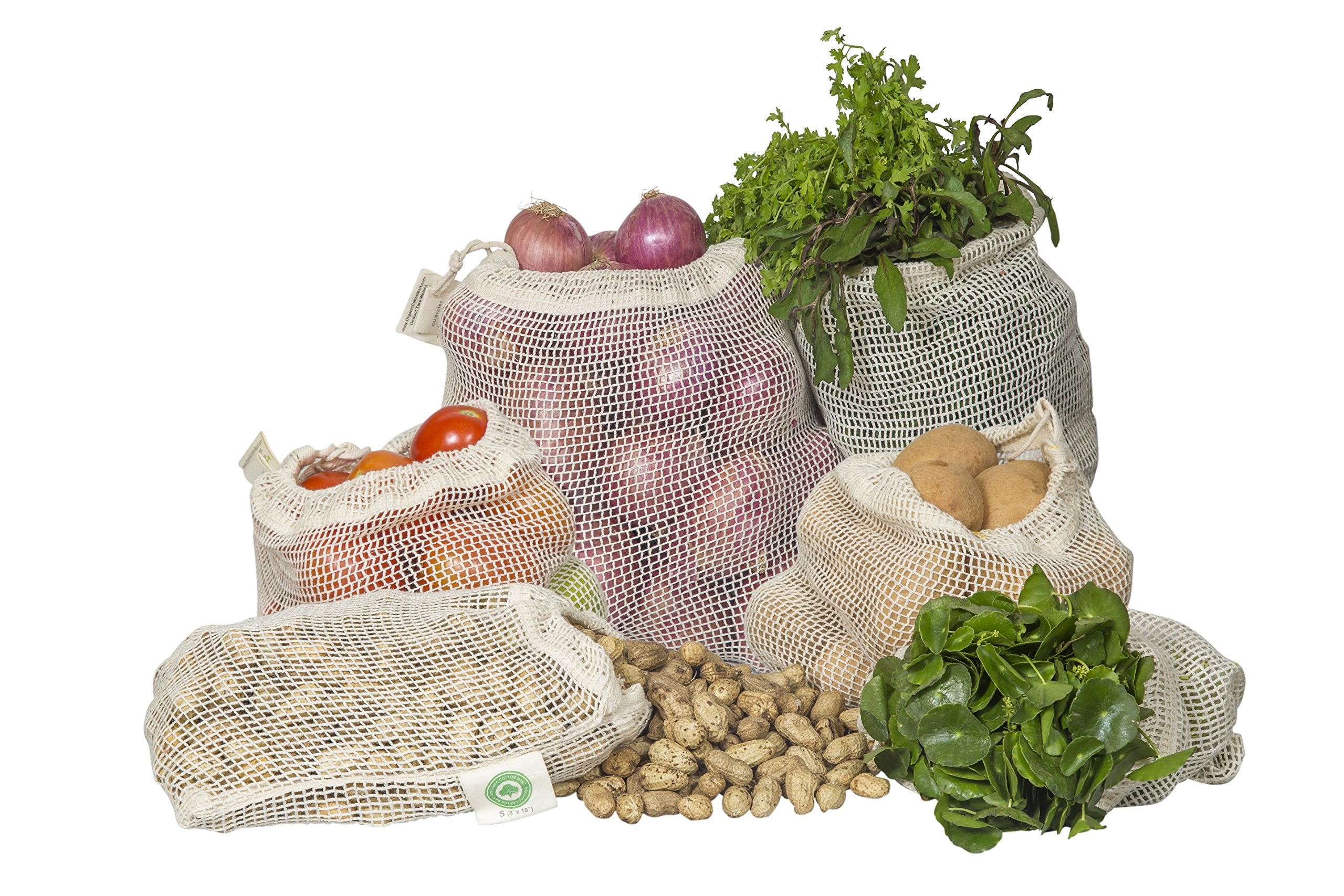 Set of reusable mesh grocery bags with vegetables and fruits on a white background