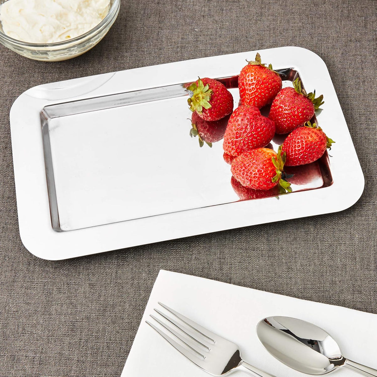 Frieling 18/10 Stainless Steel Serving Tray with strawberries on a textured surface