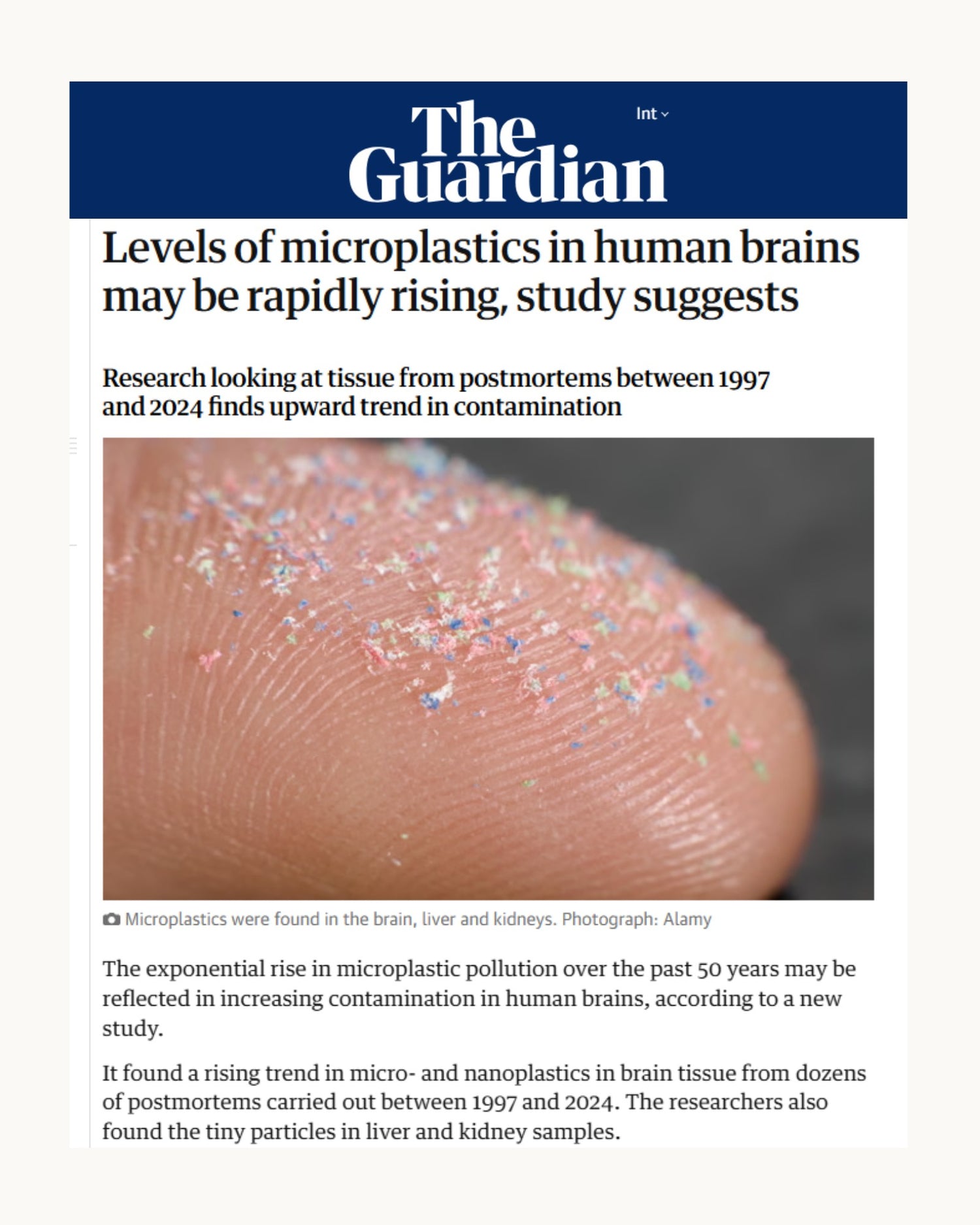 Newspaper article from The Guardian about microplastics in human brains with a close-up of a finger.